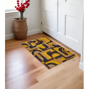 Photo of Yellow And Black Geometric Washable Area Rug