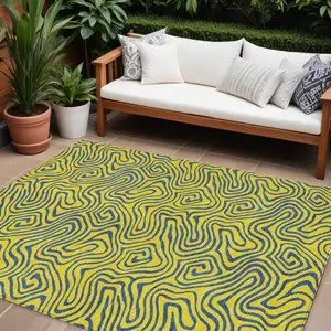 Photo of Yellow And Blue Abstract Washable Indoor Outdoor Area Rug