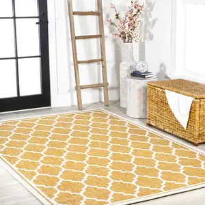 Photo of Yellow And Cream Geometric Indoor Outdoor Area Rug