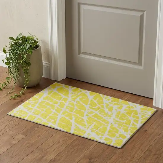 Yellow And Ivory Abstract Washable Area Rug With UV Protection Photo 1