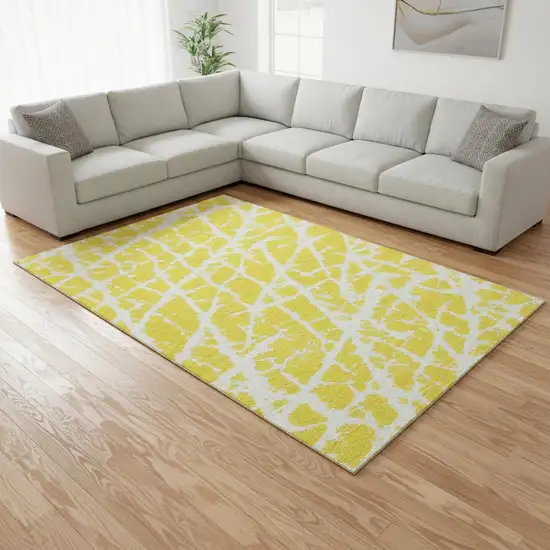 Yellow And Ivory Abstract Washable Area Rug With UV Protection Photo 1