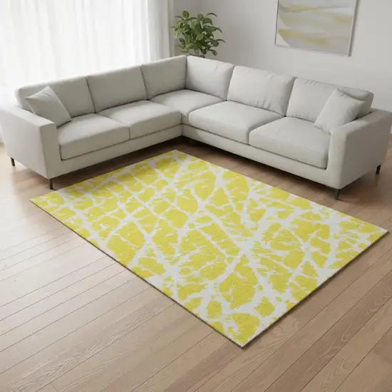 Yellow And Ivory Abstract Washable Area Rug With UV Protection Photo 1
