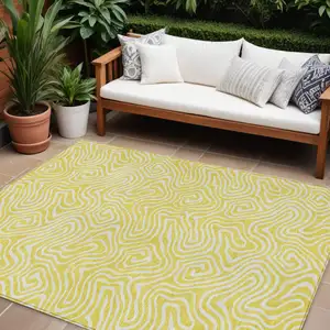 Photo of Yellow And Ivory Abstract Washable Indoor Outdoor Area Rug