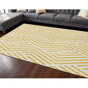 Photo of Yellow And Ivory Geometric Washable Area Rug With UV Protection