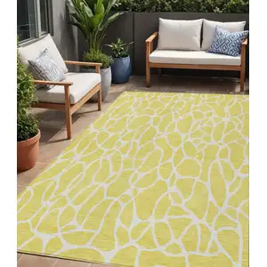 Photo of Yellow And Ivory Geometric Washable Indoor Outdoor Area Rug