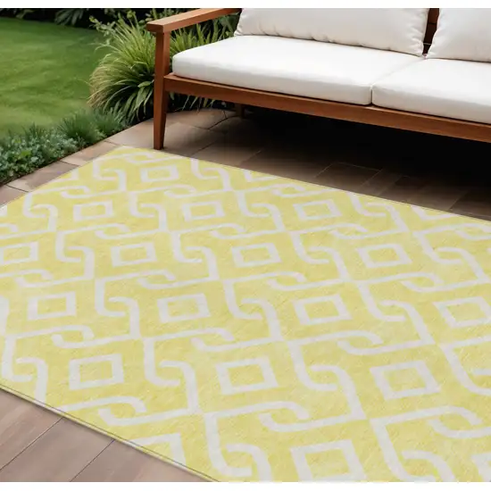Yellow And Ivory Geometric Washable Indoor Outdoor Area Rug Photo 1