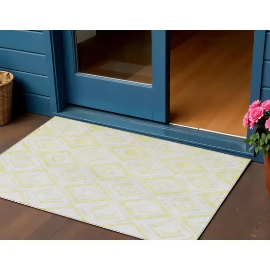 Yellow And Ivory Geometric Washable Indoor Outdoor Area Rug Photo 1