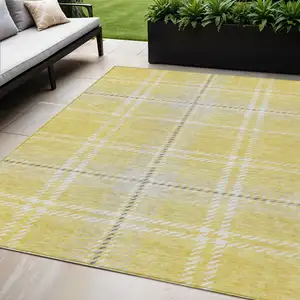 Photo of Yellow Black And Ivory Plaid Washable Indoor Outdoor Area Rug