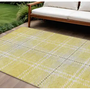 Photo of Yellow Black And Ivory Plaid Washable Indoor Outdoor Area Rug