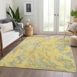 Photo of Yellow Copper And Blue Abstract Washable Area Rug With UV Protection