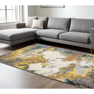 Photo of Yellow Gold Blue Grey Brown And Beige Abstract Power Loom Stain Resistant Area Rug
