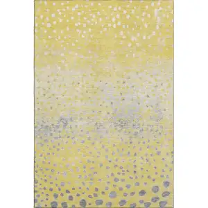 Photo of Yellow Gray And Ivory Polka Dot Washable Area Rug With UV Protection