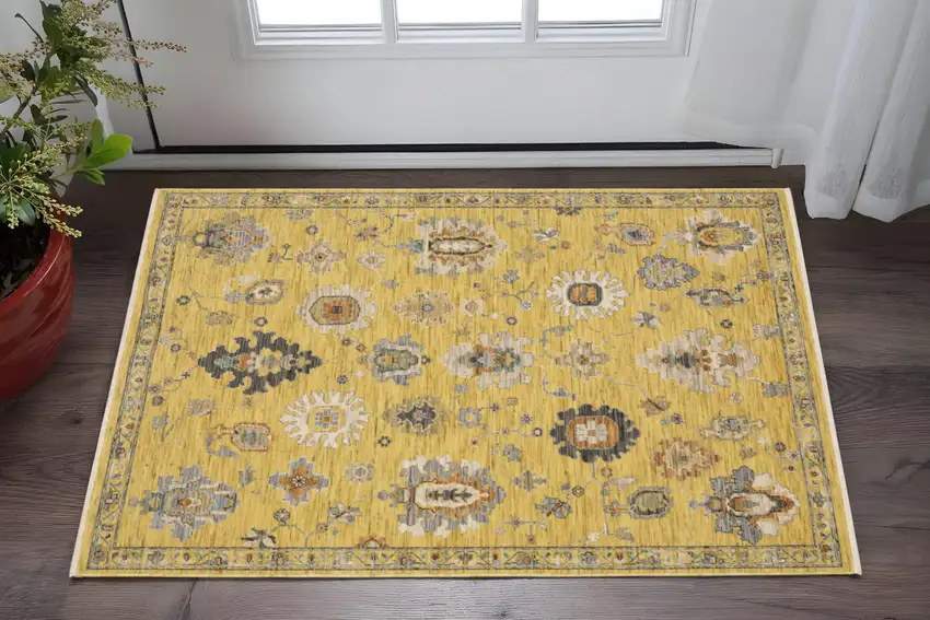 Yellow Ivory And Black Oriental Area Rug With Fringe Photo 1