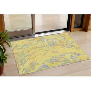 Photo of Yellow Purple And Green Abstract Washable Indoor Outdoor Area Rug