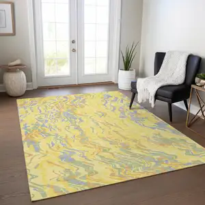 Photo of Yellow Purple And Green Abstract Washable Indoor Outdoor Area Rug