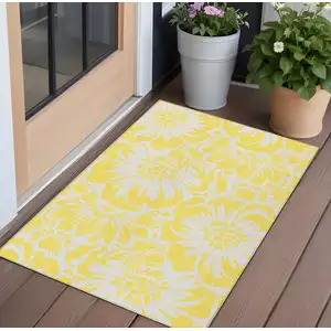 Photo of Yellow and Ivory Floral Washable Non Skid Indoor Outdoor Area Rug