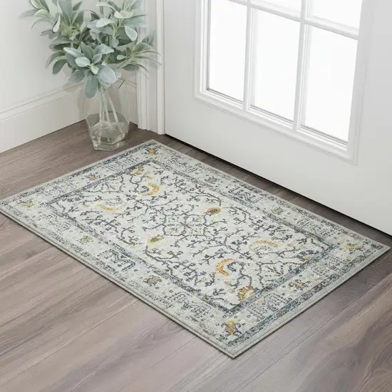 Ivory And Yellow Oriental Distressed Area Rug Photo 1