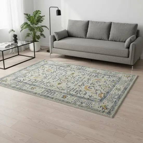 Ivory And Yellow Oriental Distressed Area Rug Photo 1