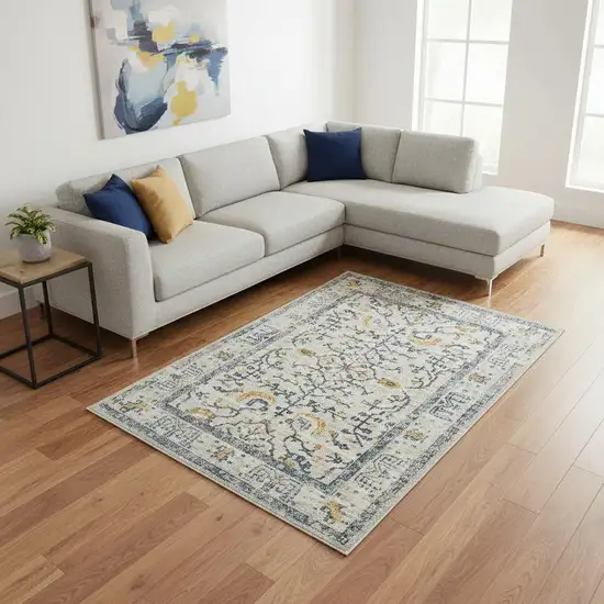 Ivory And Yellow Oriental Distressed Area Rug Photo 1