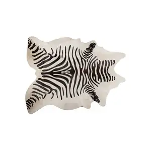 Photo of Zebra Stripe Black and White Natural Cowhide Area Rug